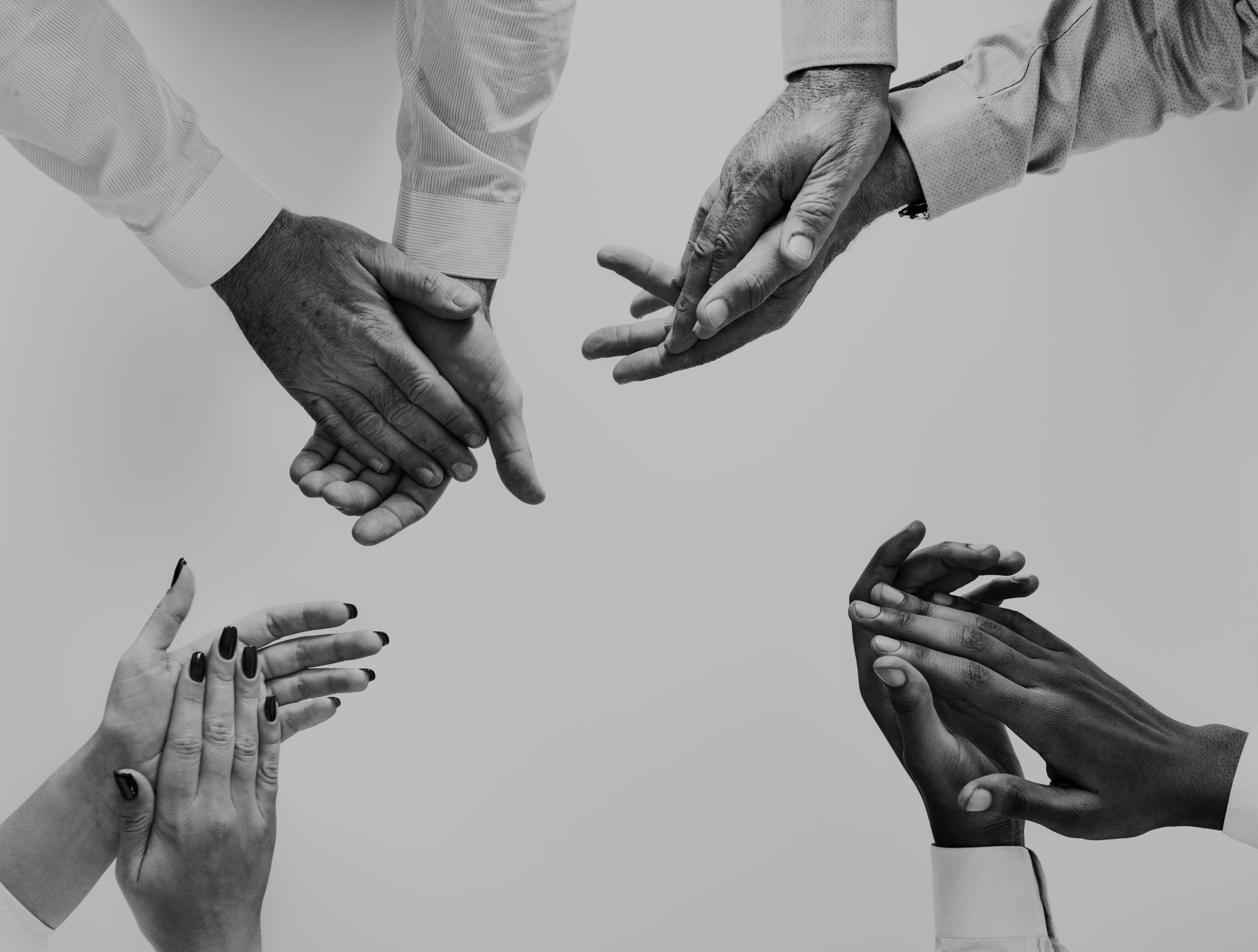 A team of developers collaborating around a screen